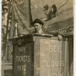 Louis Love Carnival Sideshow Showfront with Banner and ticket-taker